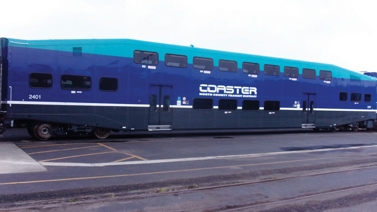 Blue and green bilevel commuter coach