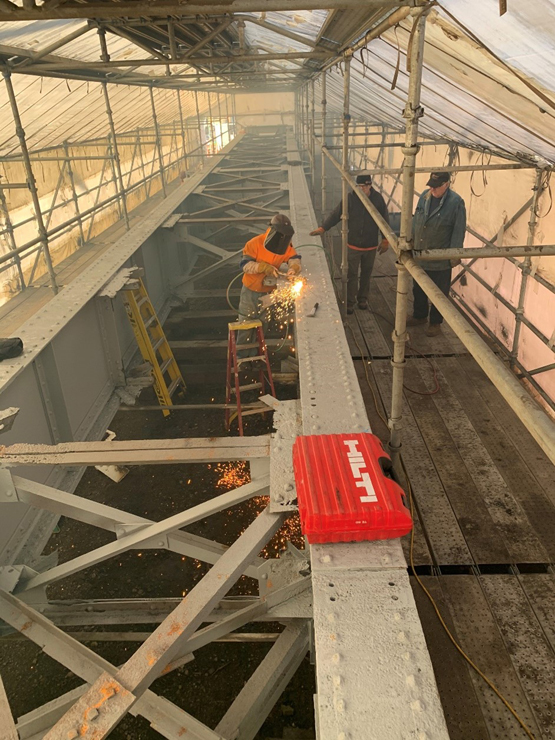 Turntable frame under tent for sandblasting