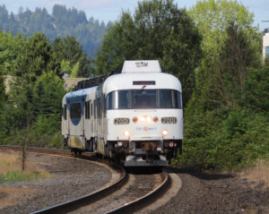 White multiple unit diesel passenger train on curve