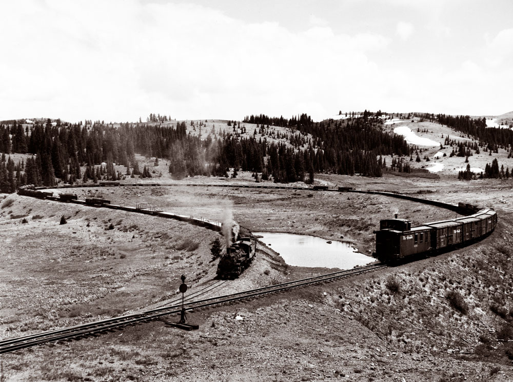 Narrow-gauge freight train on horseshoe curve