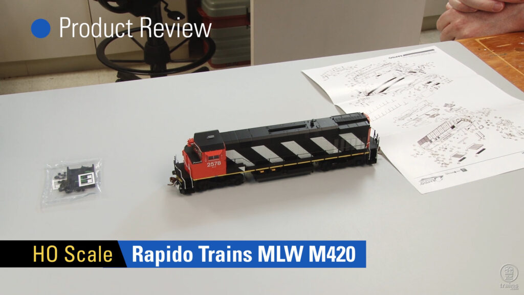 Rapido Trains MLW M420 on gray background, exploded-view diagram to right