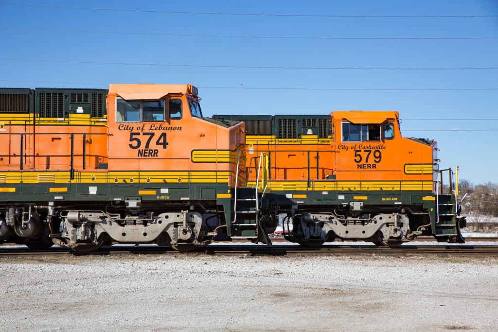 Orange locomotive cabs side by side