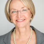 Head shot of woman with short blond hair