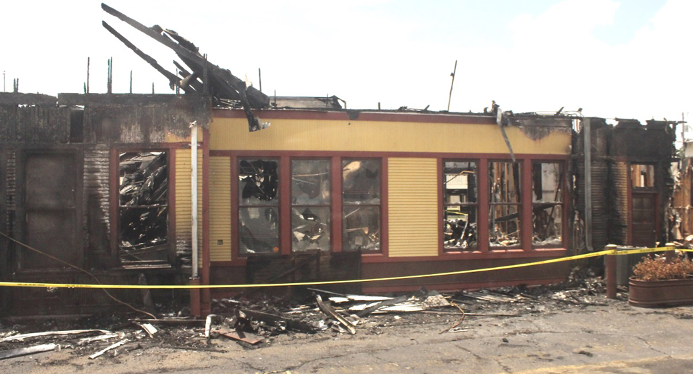 Wooden station building damaged by fire