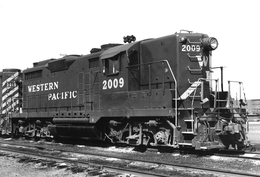 Black-and-white view of diesel road-switcher locomotive