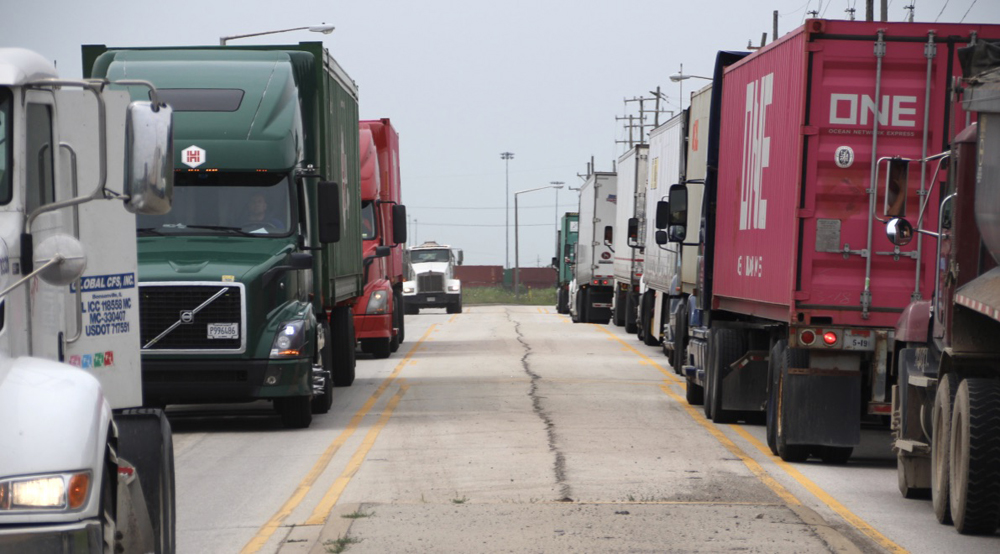 Many trucks on two-lane road