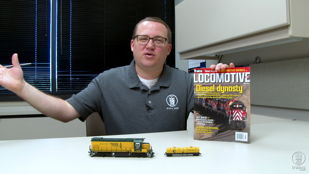 Cody Grivno with products in his office