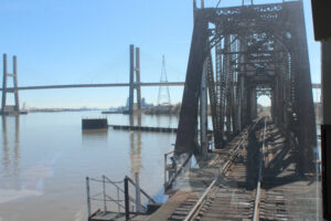 Steel railroad bridge as seen from on train