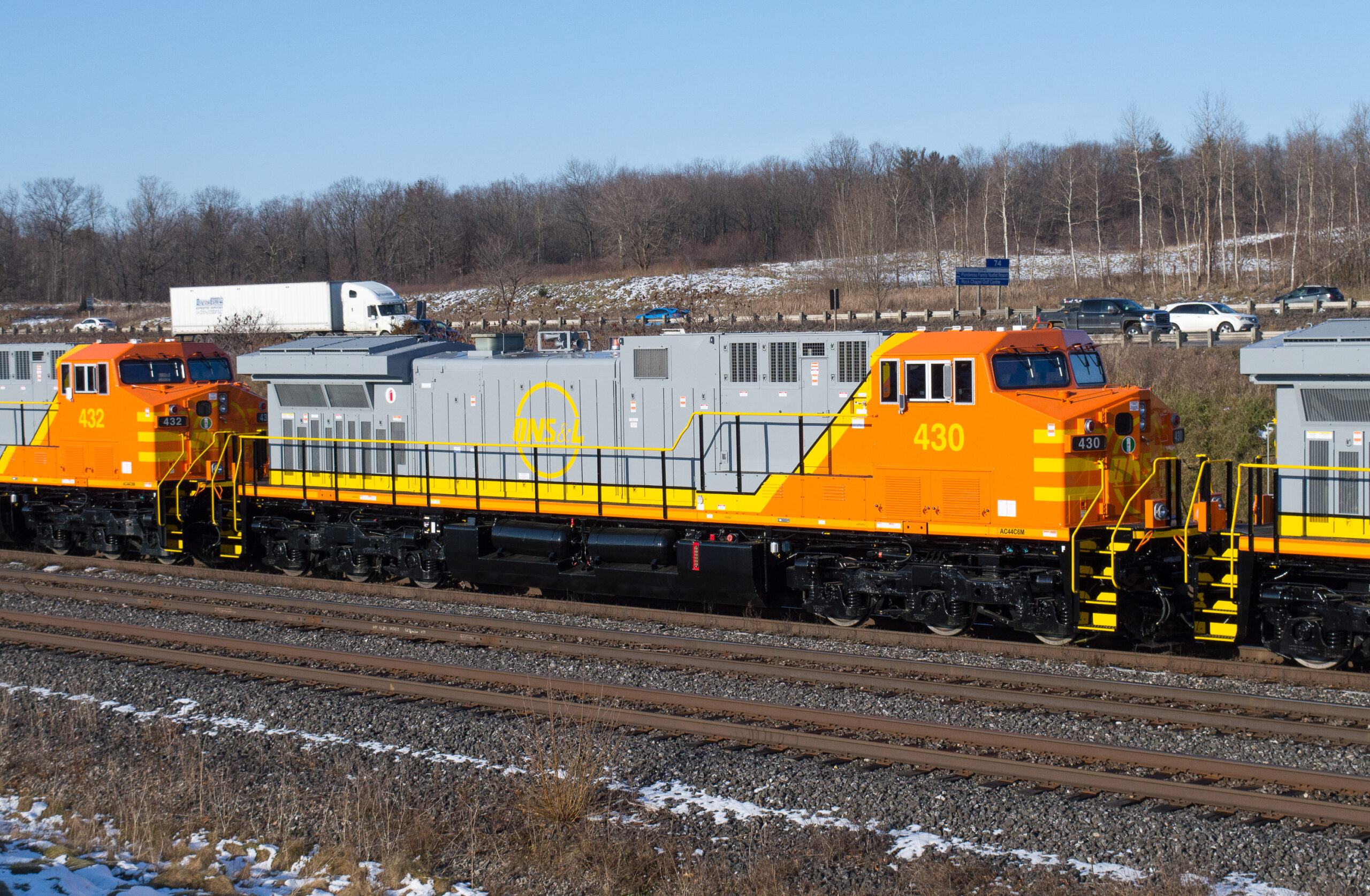 Orange, gray, and yellow locomotive