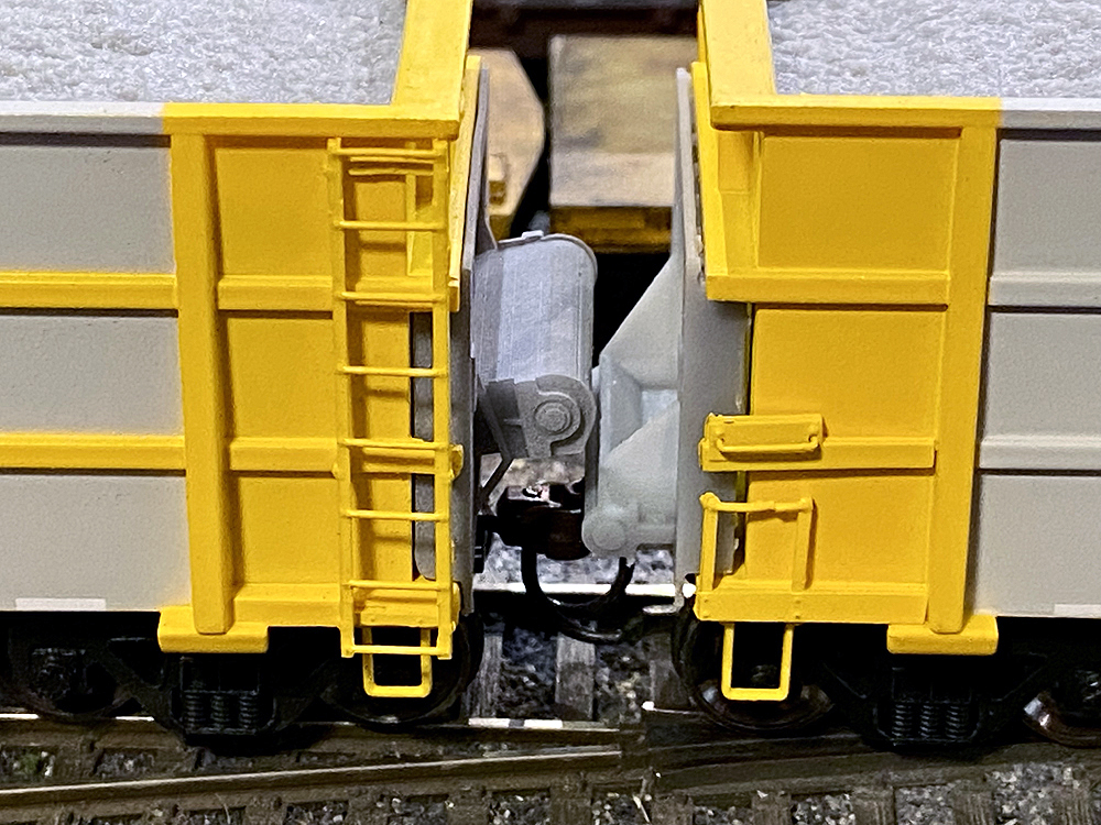 Bright yellow ballast conveyor train kit.