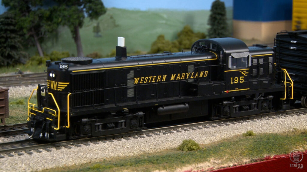 Black and yellow locomotive on layout.