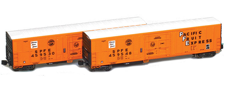 Photo of two Z scale Pacific Fruit Express class R-270-2 mechanical refrigerator cars painted orange with black ends and white roof.