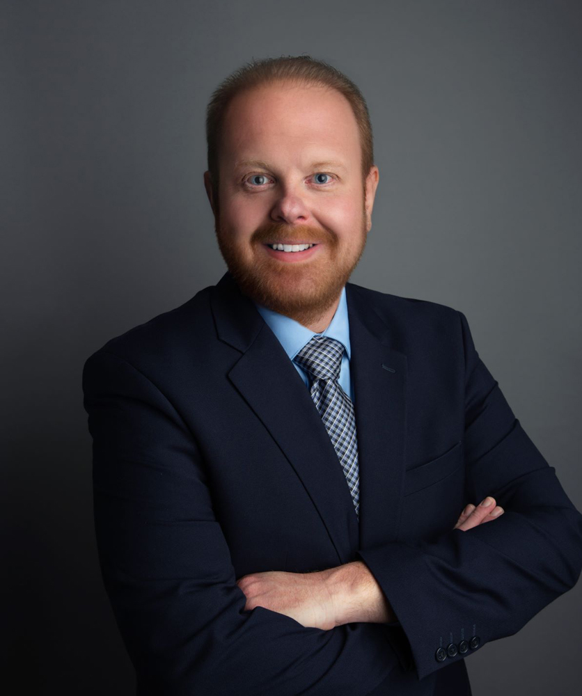 Man in dark blue suit and tie