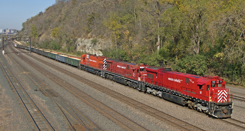 Train with three red locomotives as seen from high angle