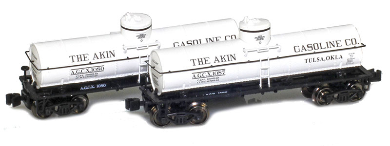 Photo of two Z scale General American Tank Car Co. 1917 8,000-gallon non-insulated tank cars painted black and white with black and white graphics.