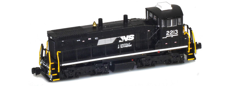 Photo of Z scale Electro-Motive Division SW1500 diesel locomotive painted black with white graphics, yellow vertical handrails, and painted brass bell.