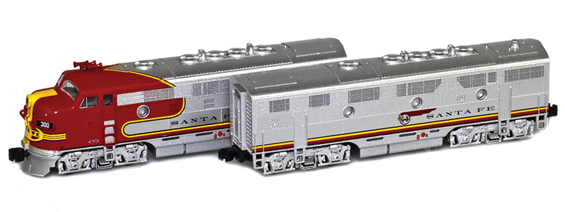 Photo of Z scale Electro-Motive Division F7A and F7B diesel locomotives painted silver, red, and yellow with black lettering. 
