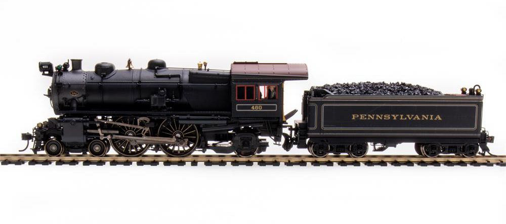 Photo of HO scale Pennsylvania RR class E6 4-4-2 Atlantic steam locomotive on section of track with white background.