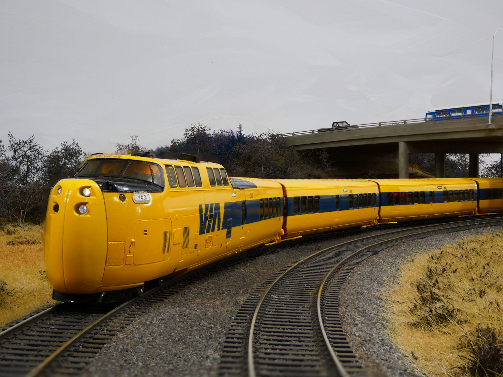 Photo showing yellow VIA Rail paint scheme of the Turbo 2.0 on a track.