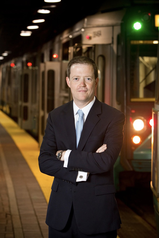 Man standing in front of subway train