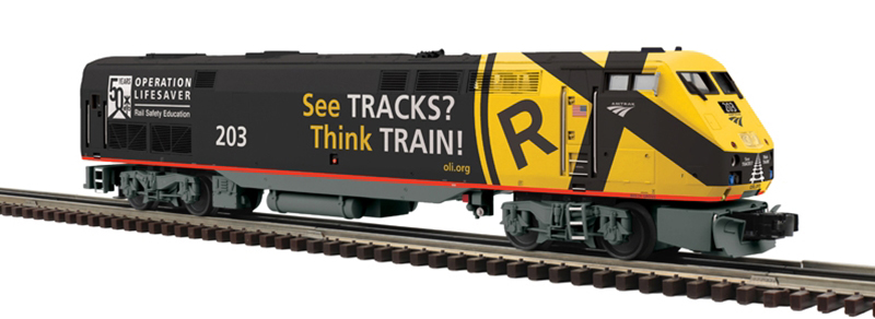 Photo of O scale diesel locomotive painted black, gray, red, white, and yellow.
