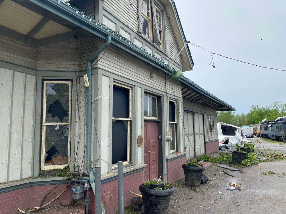 Wooden train station building with broken glass and other visible damage