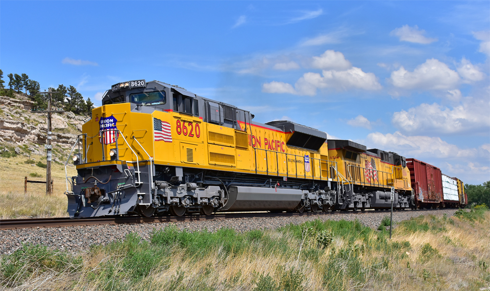 Yellow locomotives on freight train