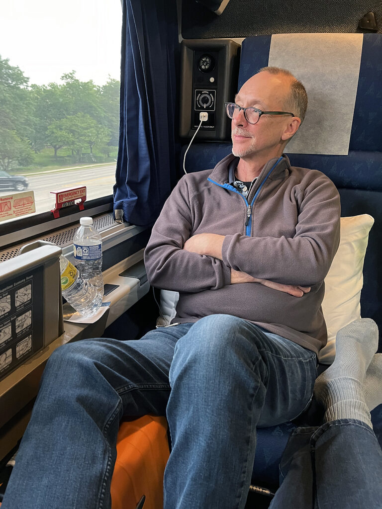Man sitting in a roomette.