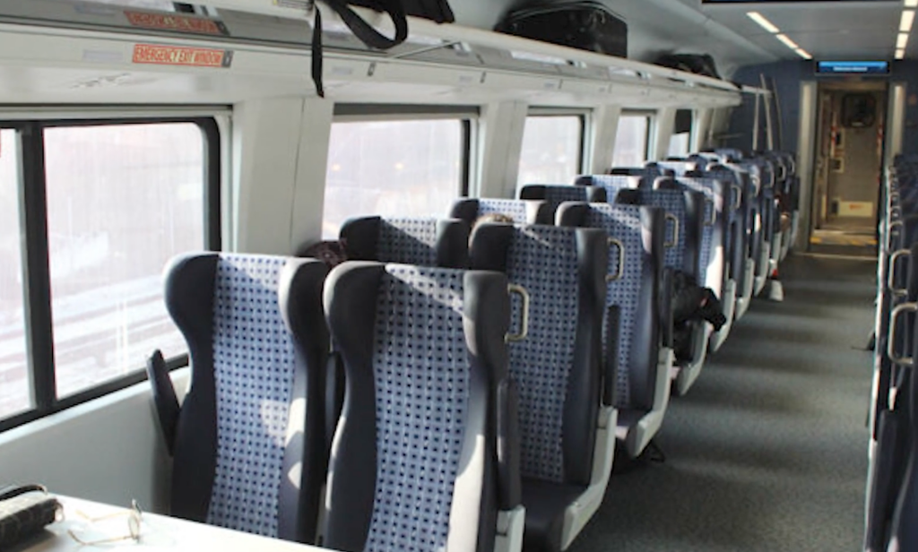 Seats in a new Amtrak passenger train coach car.