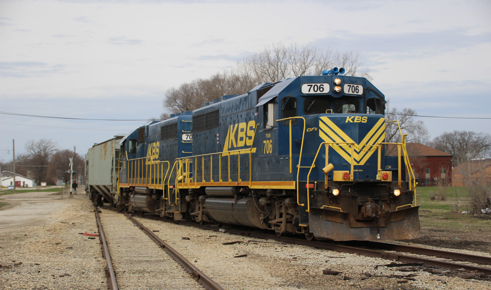 Blue and yellow locomotives switching