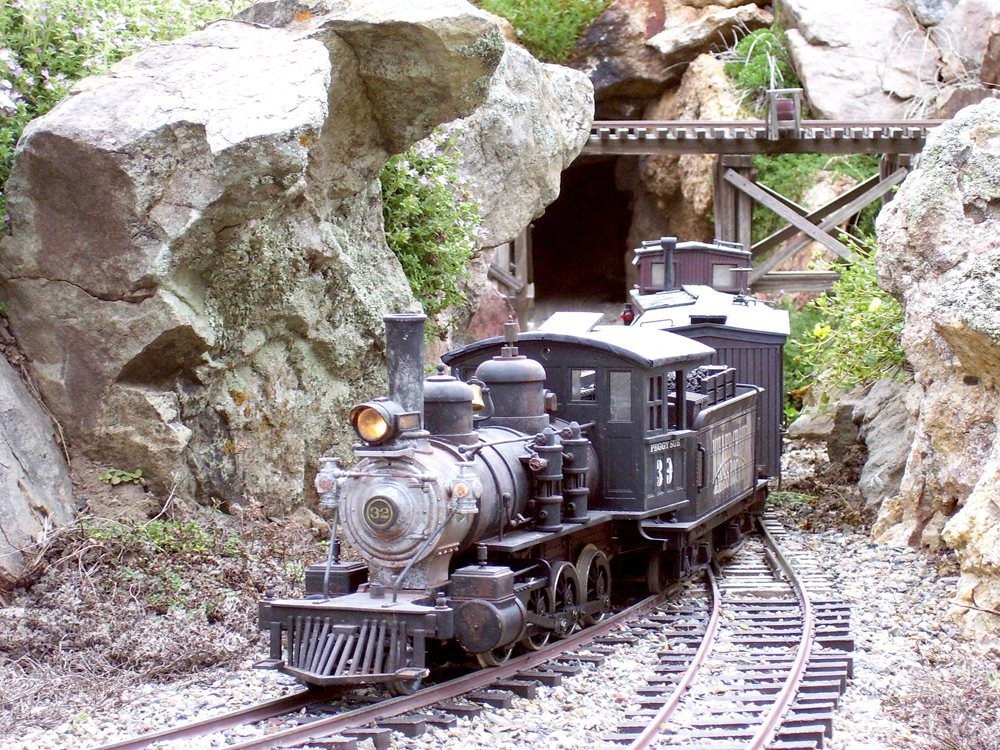 close up of model steam engine on track