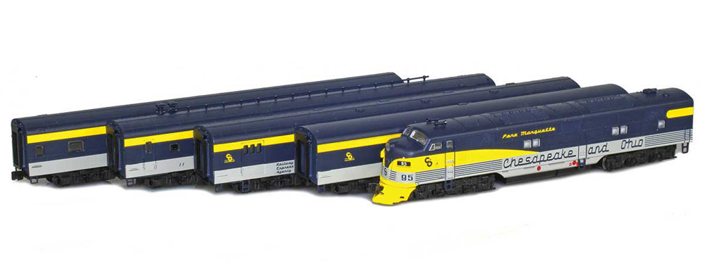 Set of blue, silver, and yellow passenger cars and a streamlined diesel locomotive