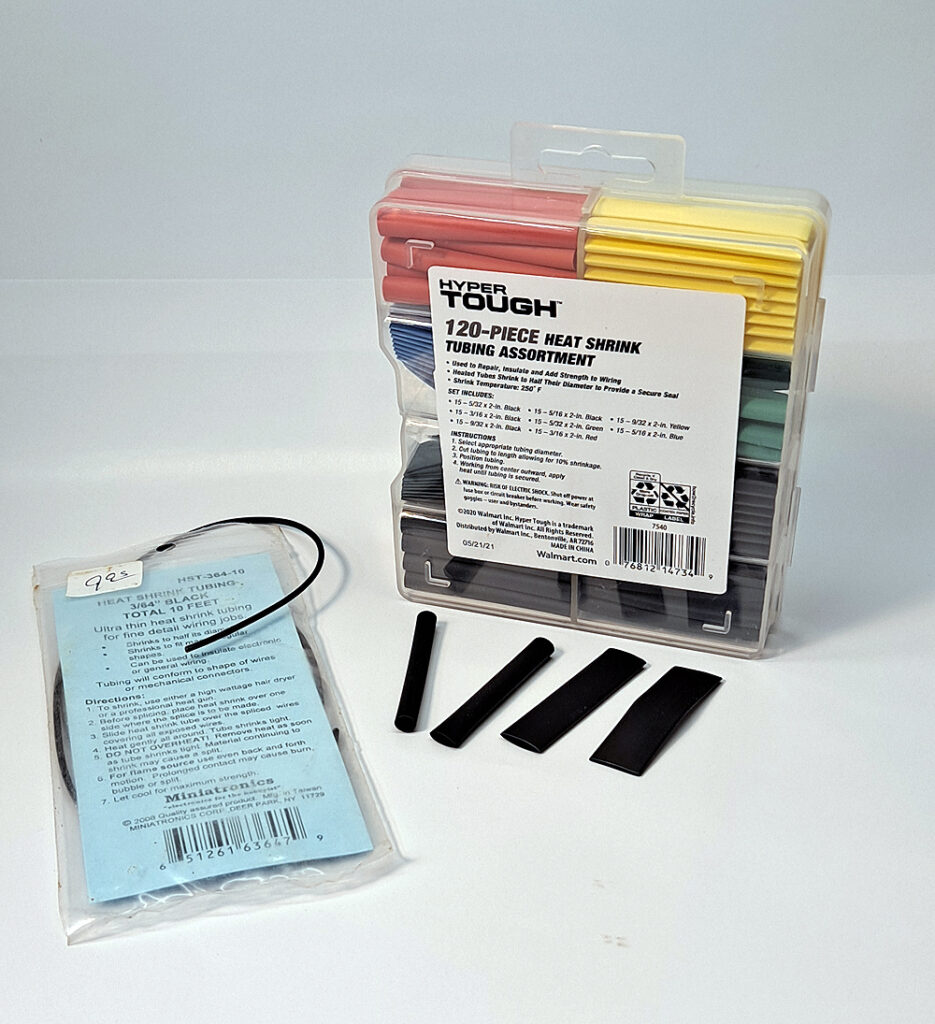 Package of small-diameter heat-shrink tubing next to box of multi-colored, pre-cut tubing