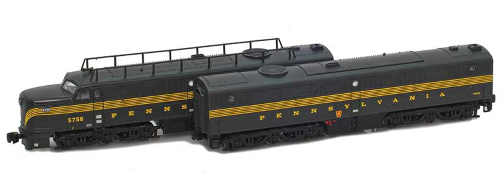 Model of dark green and gold streamlined diesel locomotive