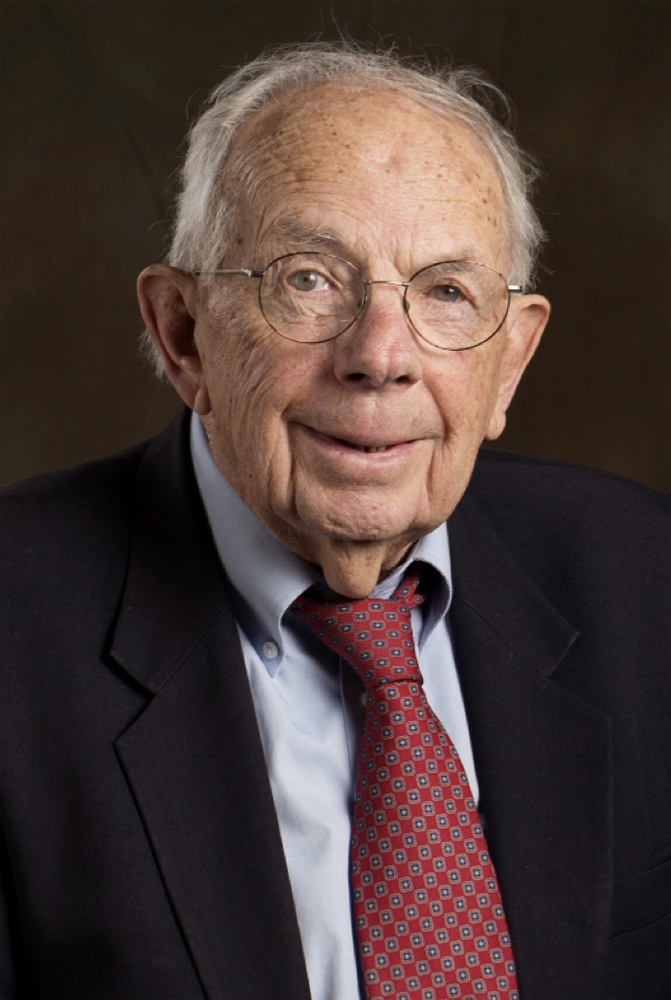 Older man in coat and tie