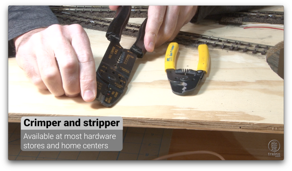 Working with wire cutters - A pair of hands next against a wooden table comparing two pairs of tools with the caption reading "crimper and stripper"