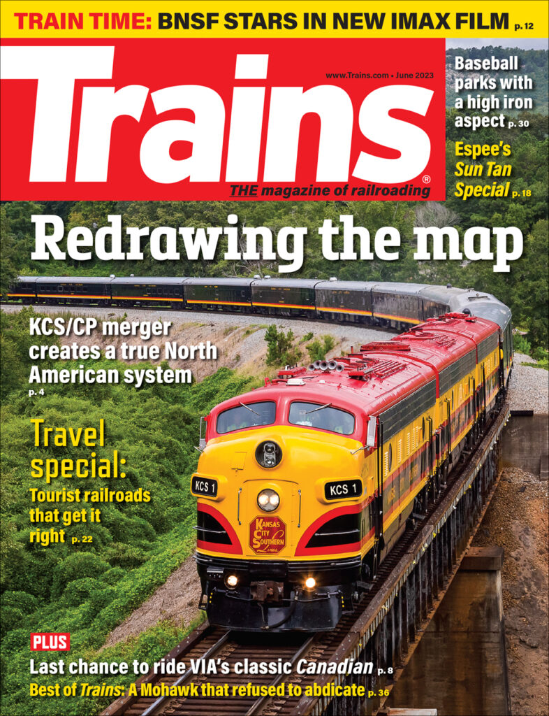 red and yellow locomotive on June 2023 cover