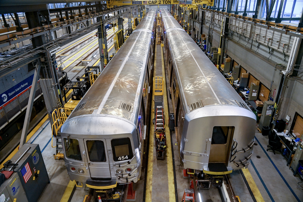 Overhead view of railcars in shop building
