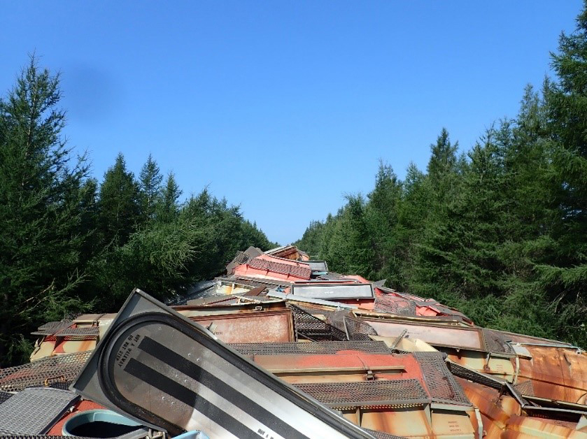 View of derailed cars perpendicular to track