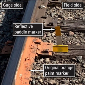 Annotated photo of paddle marker to indicate clearance limits in rail yard