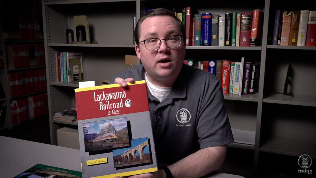 Delaware Lackawanna & Western MU cars: an image of a man seated holding a book