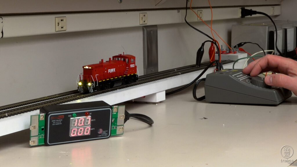 DCC locomotives compatible with DC layouts: An image of a locomotive on a set of test rail