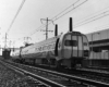 New stainless steel Penn Central passenger trains equipment on curve