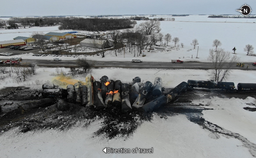 Aerial view of derailment including burning tank cars