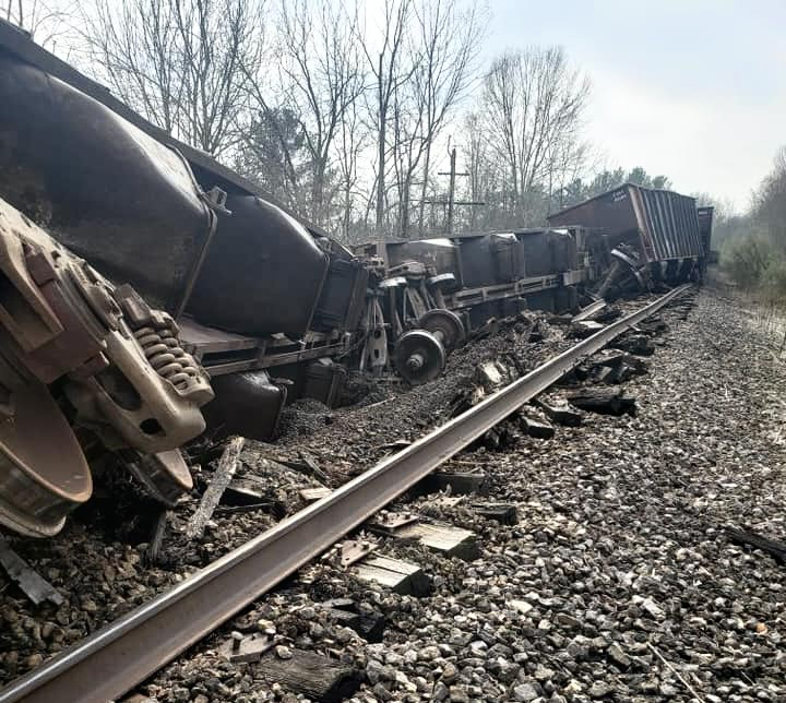 Derailed hopper cars and damaged track