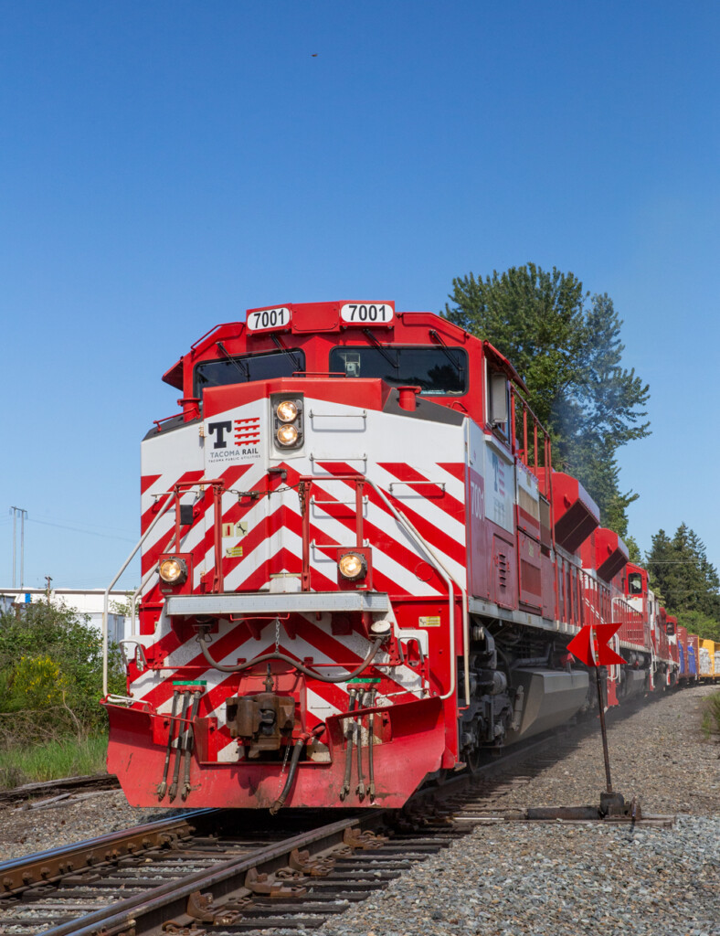 Red and white contemporary diesel locomotive. Tacoma Rail Ends Service to Frederickson Washington