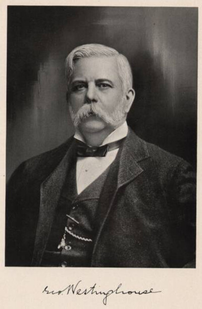 1800s black and white photo of well-dressed man with sepia photo border and written text which reads "George Westinghouse"