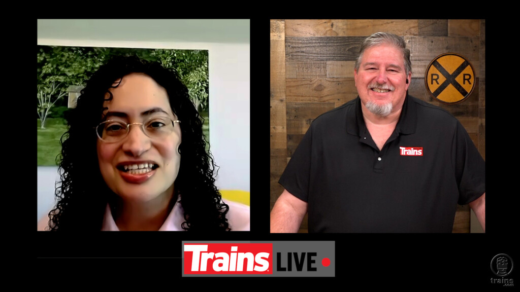 Woman and man in TV interview. Trains LIVE — Walk through fire