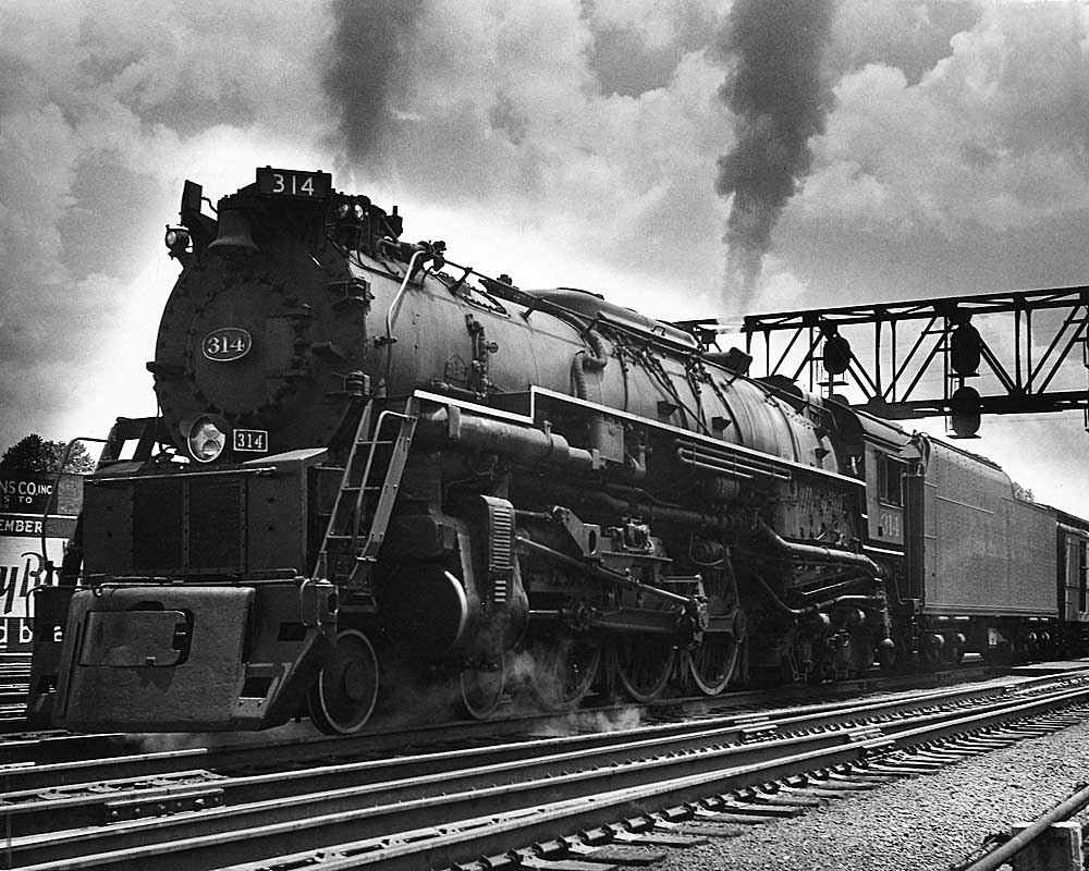 Heaviest 4-6-4 Hudson steam locomotive under signal bridge