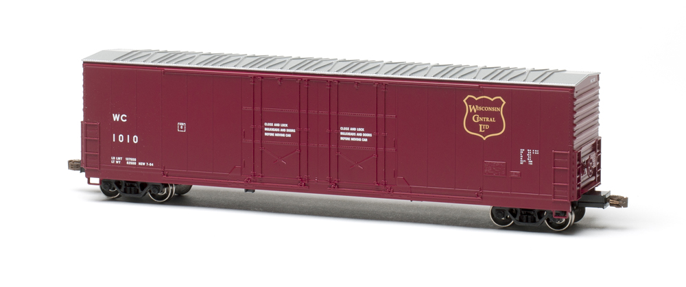 Color photo of HO scale 50-foot boxcar painted maroon with aluminum roof.